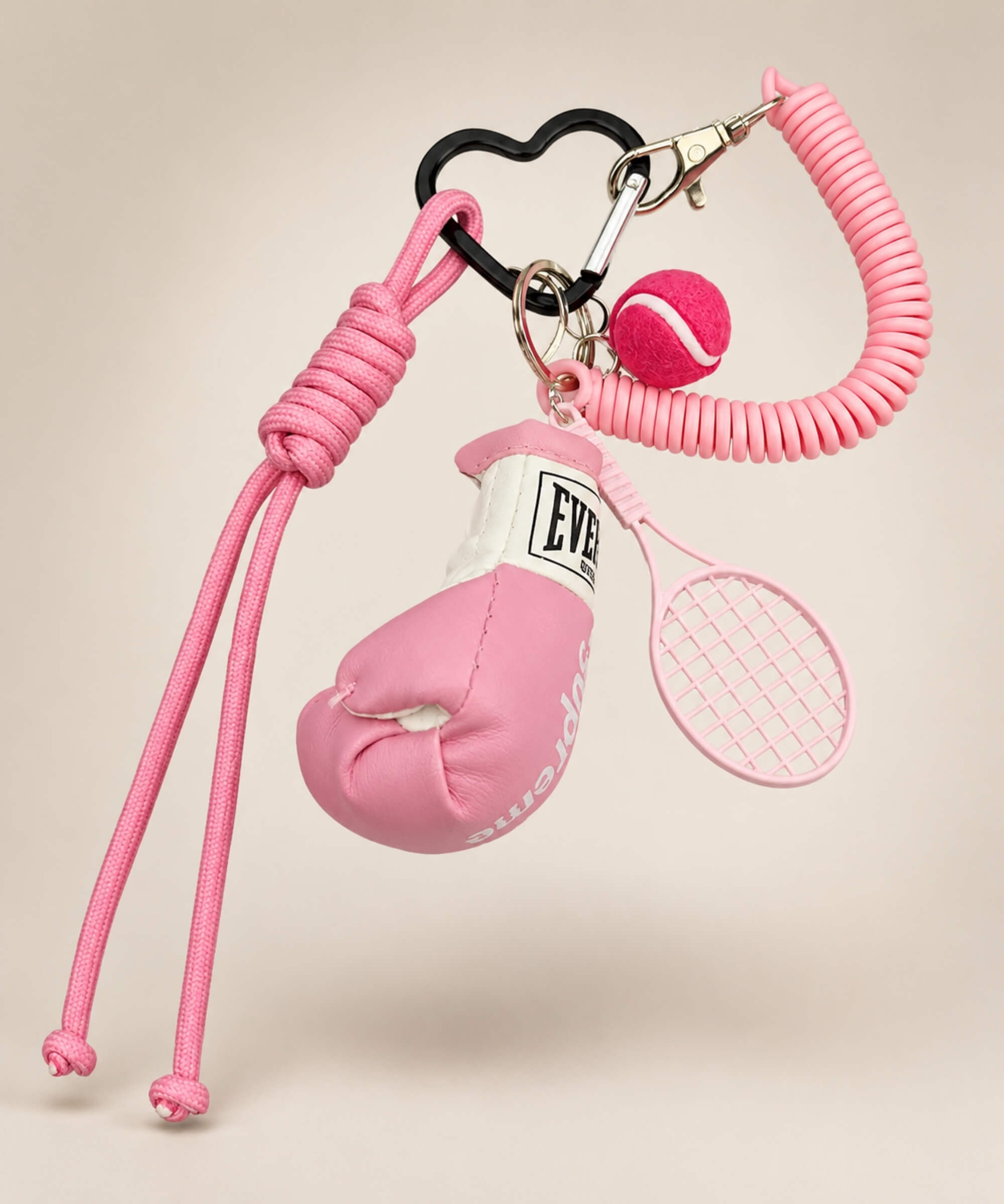 Pink boxing glove and tennis rope keychain with tennis racket and tennis ball charm